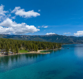 drone view of lake and mountains