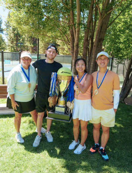 tennis tournament winners with trophy