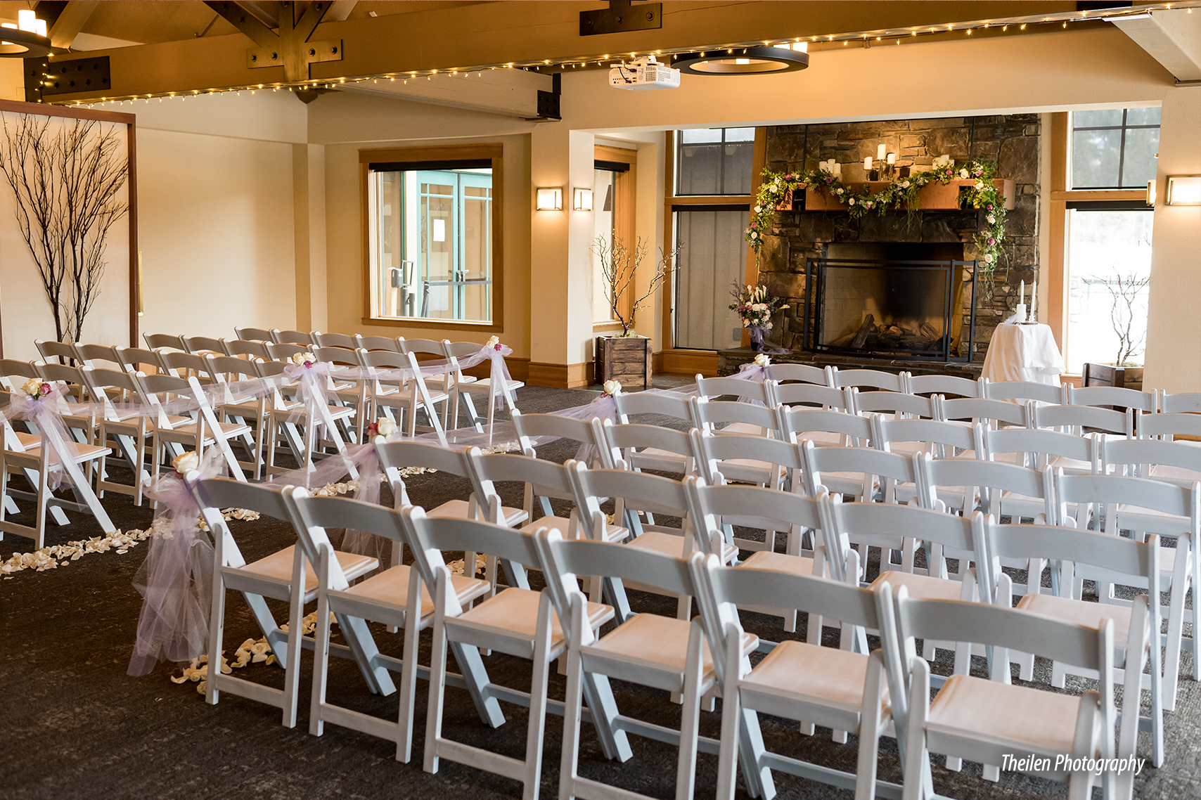 fireside ceremony set up with white chairs