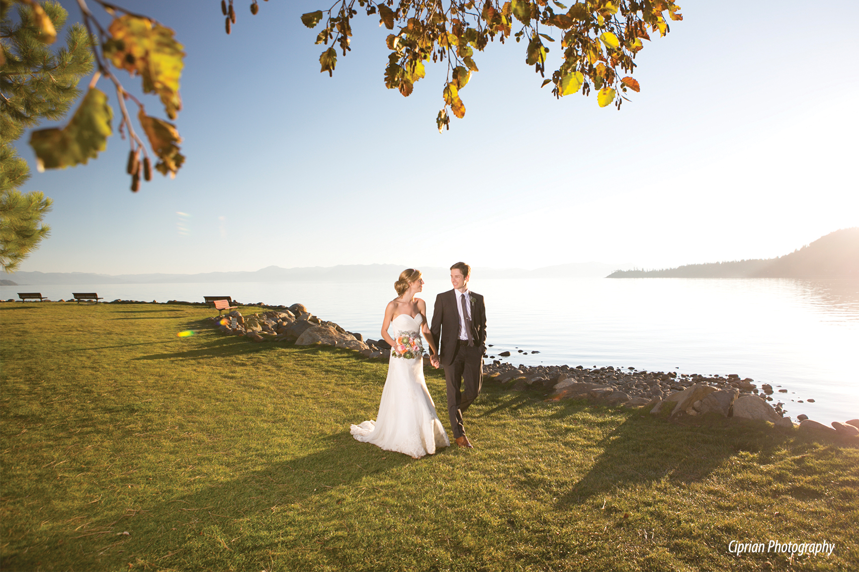 bride and groom walk on beach peninsula grass