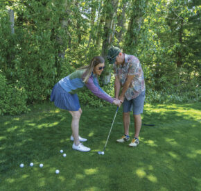 Robyn teaches a golf lesson
