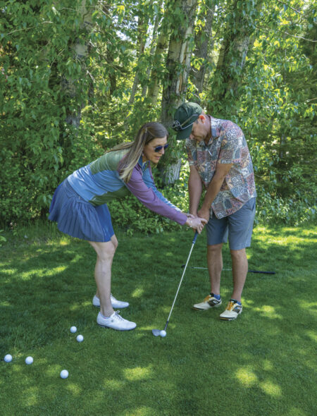 Robyn teaches a golf lesson