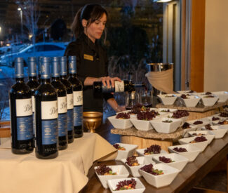 wine and tapas event server pouring wine