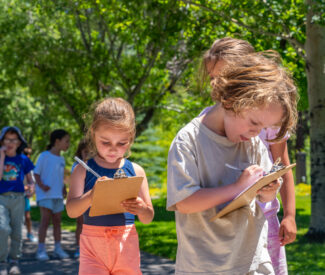 kids at recreation camp outdoor scavenger hunt