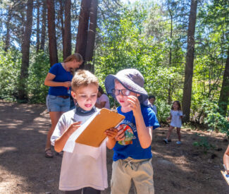 kids at recreation camp outdoor scavenger hunt