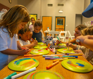 kids at recreation camp craft time