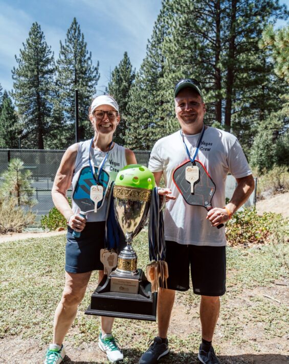 pickleball tournament players with trophy