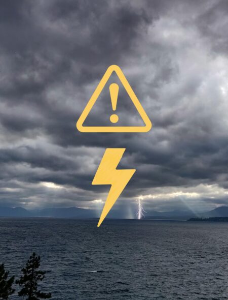 lightning alert graphic over stormy lake tahoe