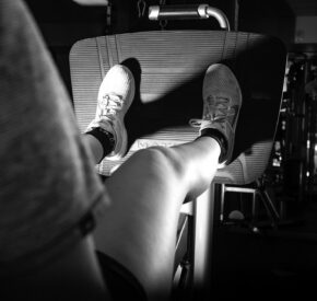black and white woman leg press