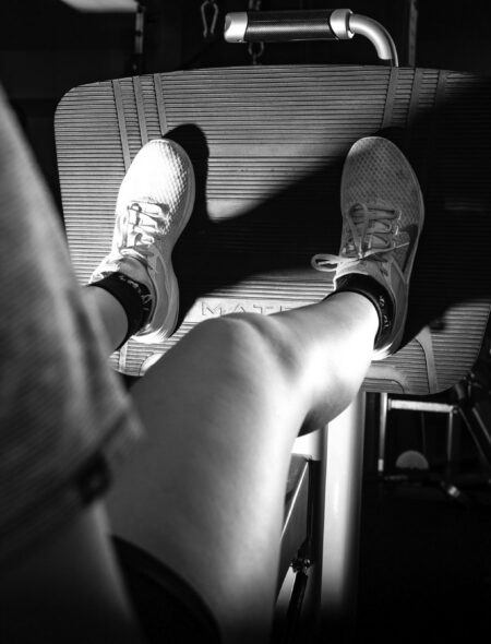 black and white woman leg press