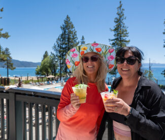 ladies with cocktails on the pool balcony